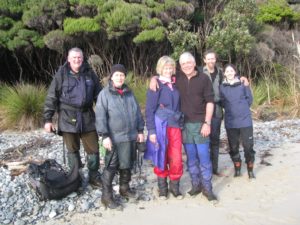 The trap checking team waiting for pickup by 'Southern Winds'. Ian Buick and his wife, Angela McMeekin are pictured centre.