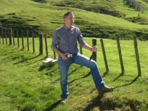 Simon Croft on a farm in the Hawkes Bay near the Mohaka River. Prototype Celium node in hand and new style of kill trap that is easy to clear being developed by Hawke’s Bay Regional Council in the background.