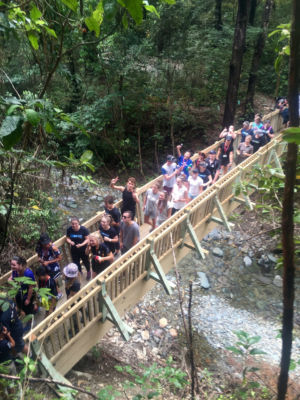 A new wooden bridge with many people on it