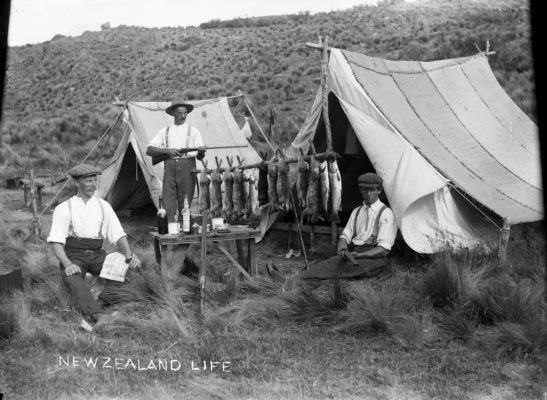 Men at their campsite displaying their catch of rabbits and fish (1909). Photo: National Library (Wikimedia Commons).