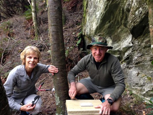 Gillian and Derek checking and setting traps in the forest.
