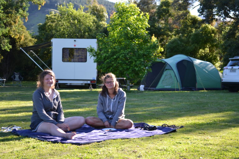 Campers relax at Smiths Farm Holiday Park.