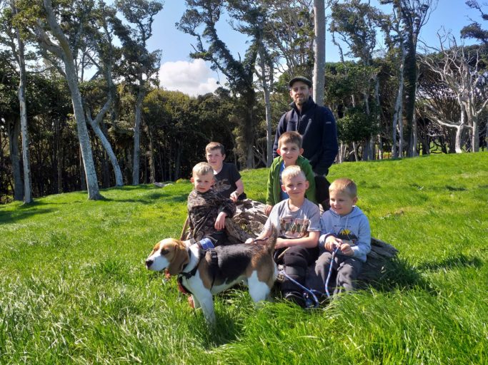 Andy Saunders with some of the local Rat Rangers (and Louie the beagle.) The trees beyond have resident long tailed bats.