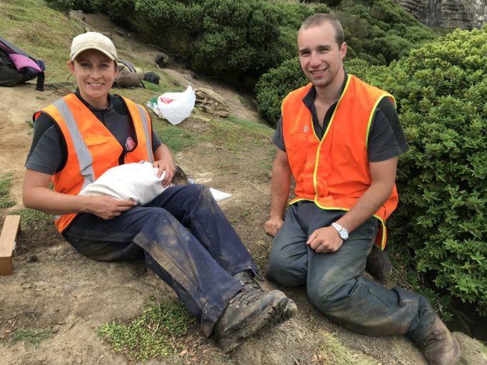 Ben and Trudi (Trust scientist) preparing to transponder a fledging hoiho chick.