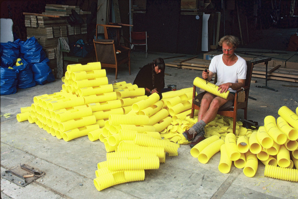 Field workers prepare a huge pile of yellow bait stations for Breaksea Island