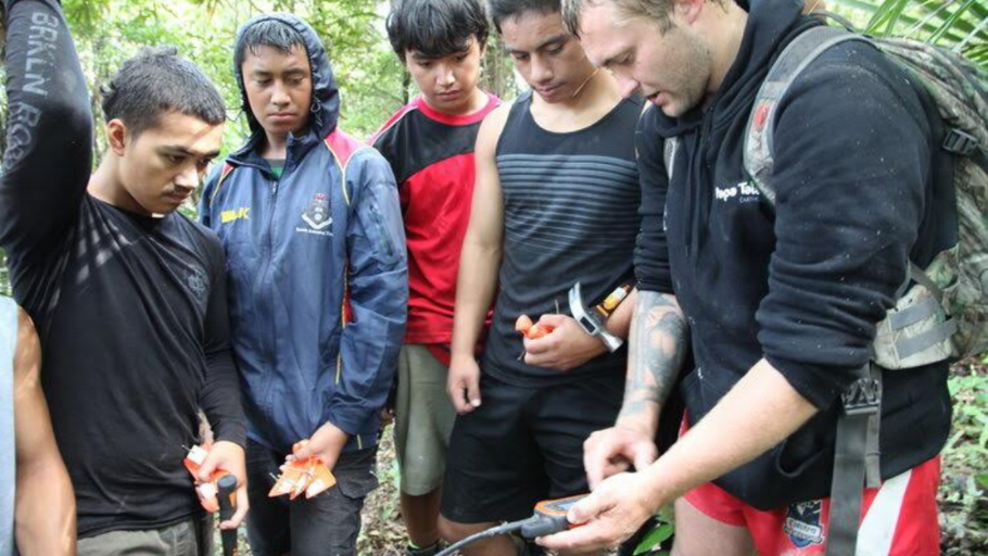  Group of secondary students learning how to use GPS.