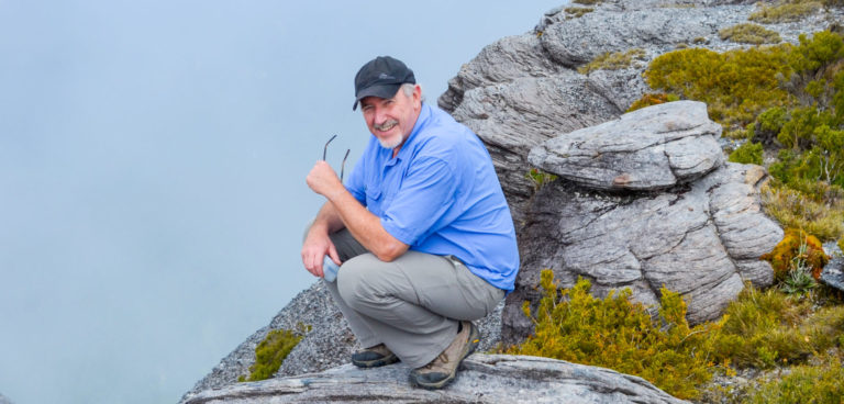 Rod standing on a big boulder