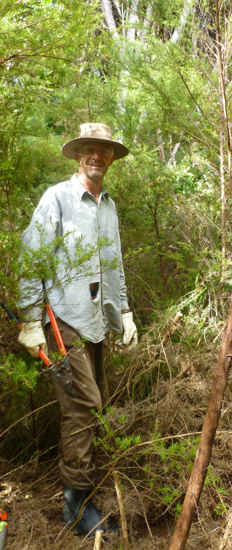 Eion in the bush setting rat traps.