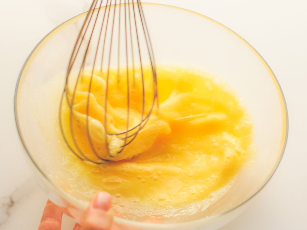 Egg yolks being whisked.