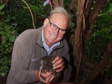 Rob Fenwick holding a kiwi