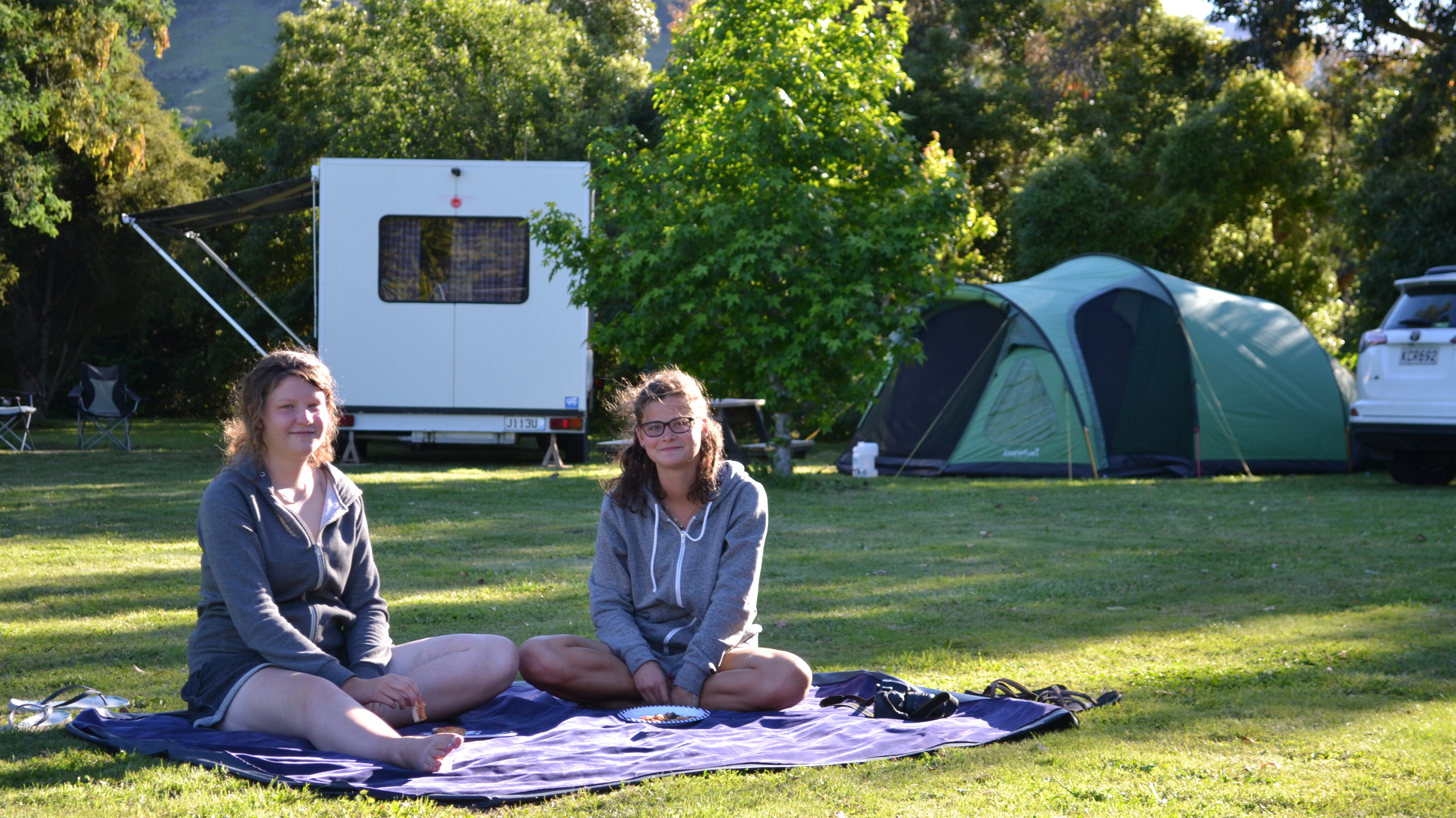 Campers relax at Smiths Farm Holiday Park.