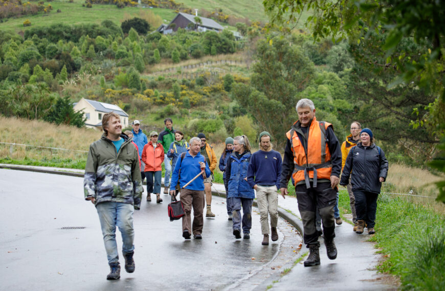 A group of people walking down a road and pathway