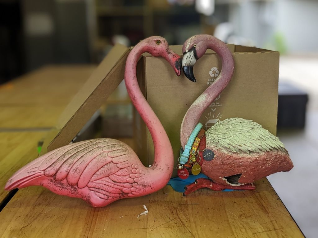 A pair of plastic flamingos