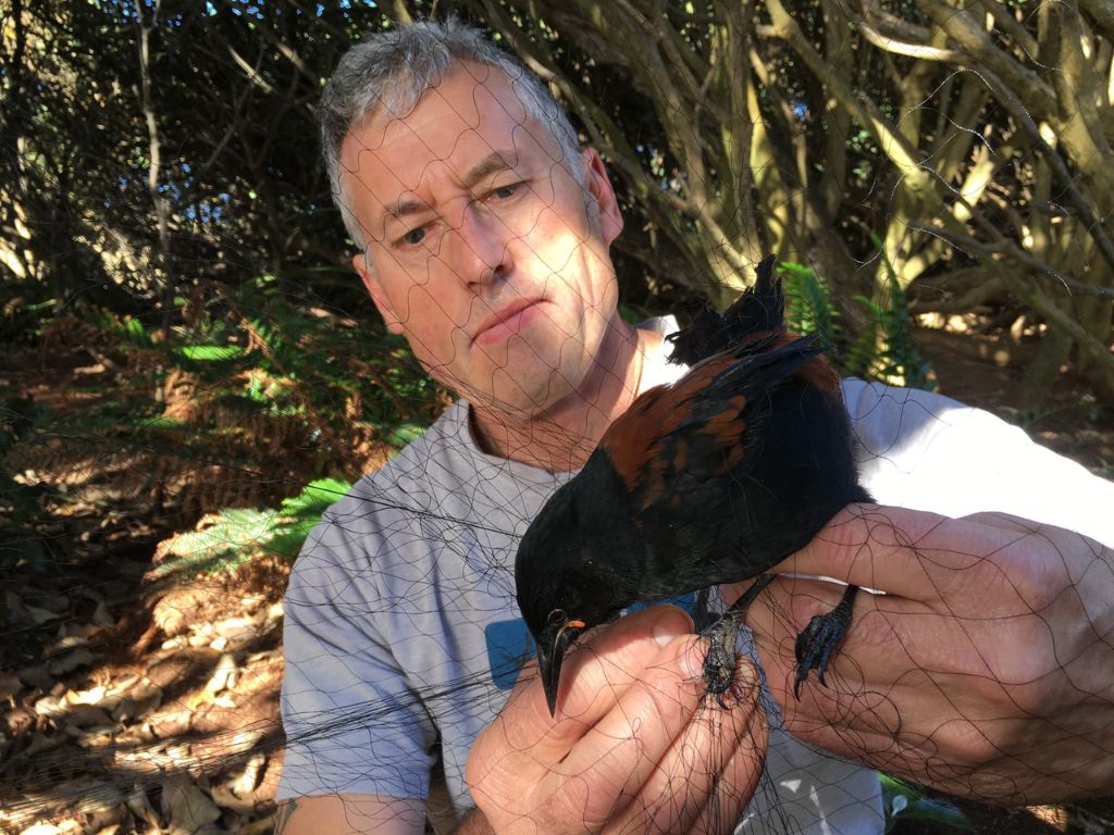 A man holding a tieke