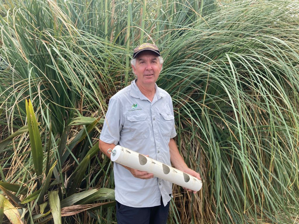 Phil holding one of his inventions in the field.