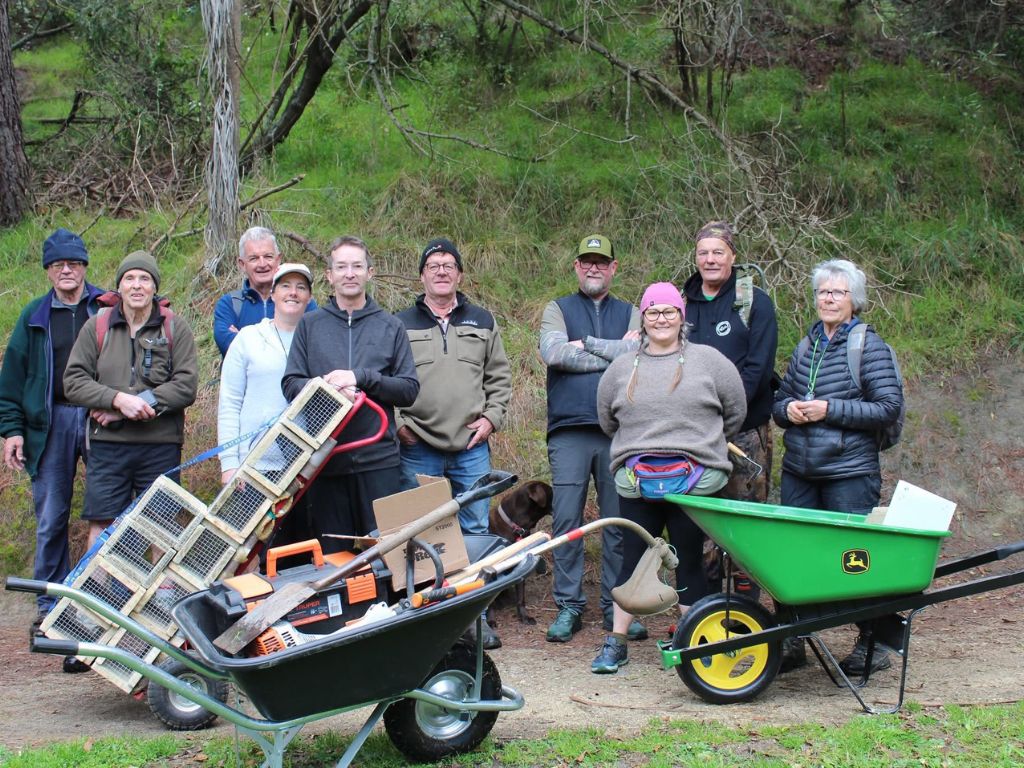 A crowd of volunteers with traps