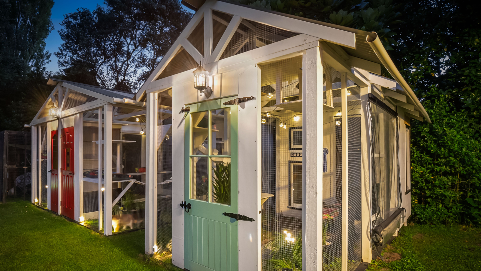 Catio chalets made with recycled materials. Catios can come in all shapes sizes and prices. Image credit: Wendy Powell